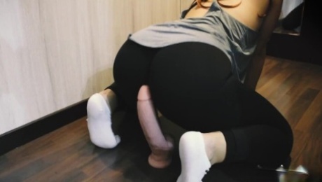 I film my fitness coach rubbing her pussy with a huge dildo. She has a perfect ass in yoga pants